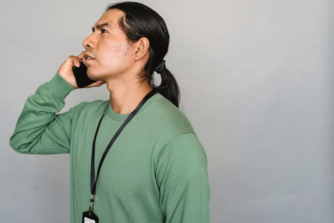how to stop spam calls on android - man annoyed at unwanted phone call
