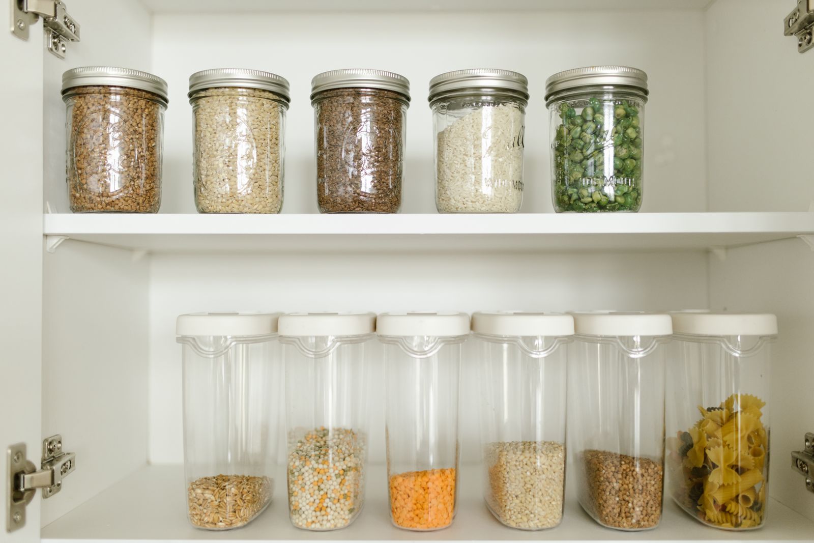 how to get rid of pantry moths — pantry shelves with airtight food storage containers
