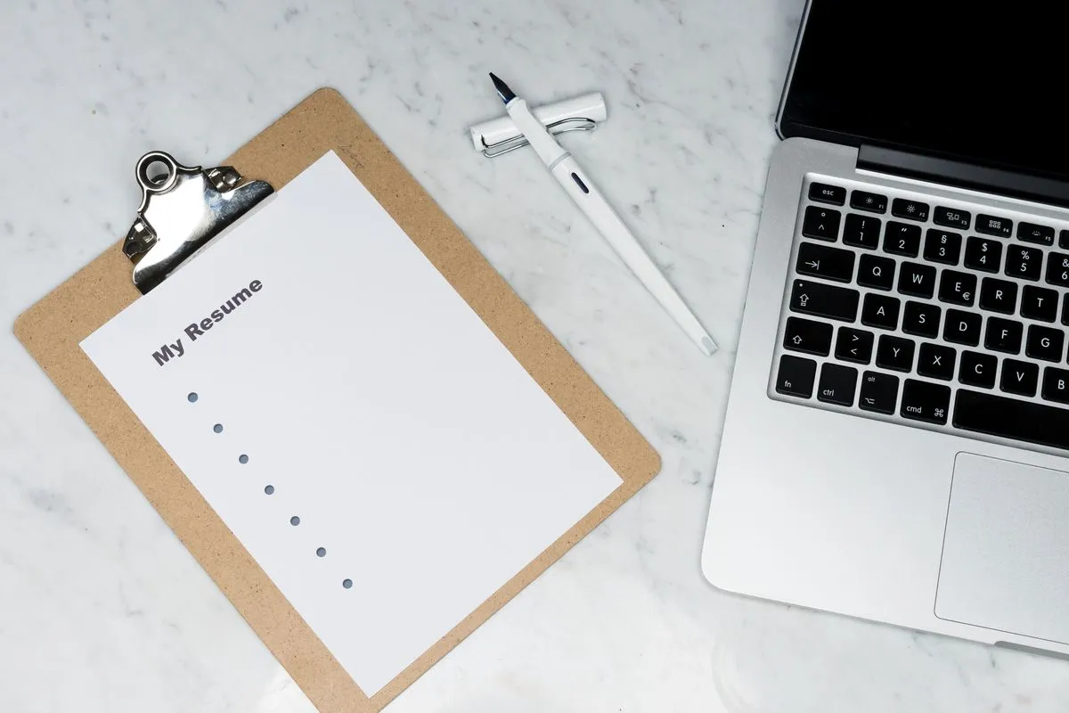 how to write a resume with no experience for first job - resume and job application documents on a desk